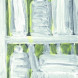 White bottles on a green background